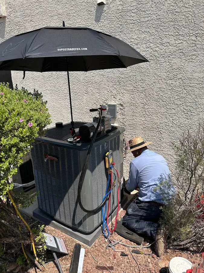 HVAC technician performing outdoor AC maintenance in Jacksonville