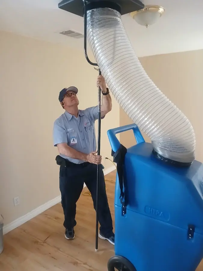 Furnace Tune-Up technician using HEPA equipment in Jacksonville